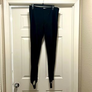 Black H&M stretchy stirrup trousers. Size large.
